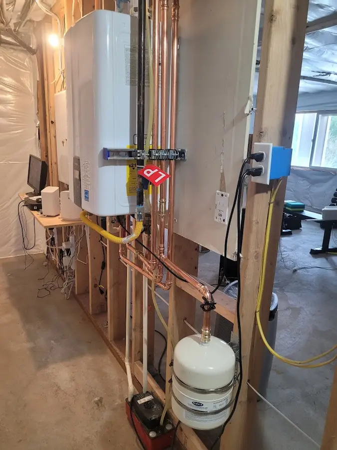 Licensed plumber repairing a kitchen sink in Scappoose